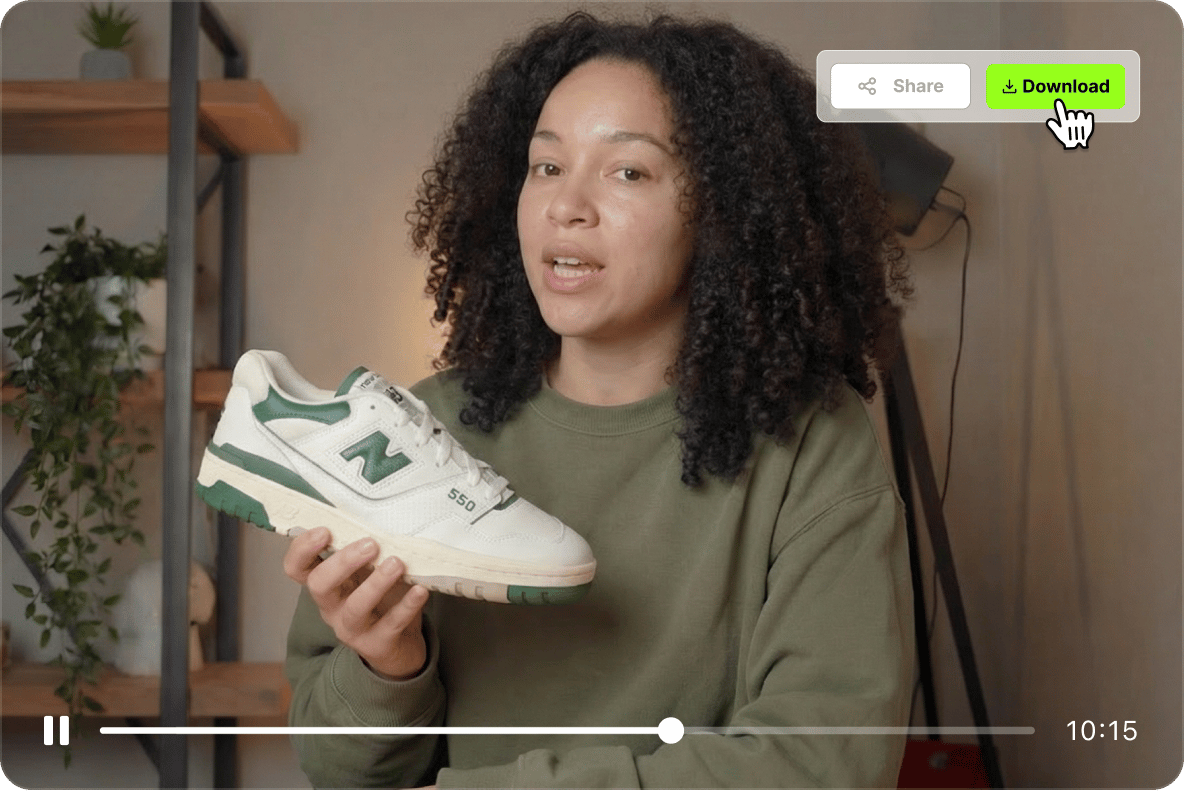 A woman presenting a sneaker in a video with a cursor hovering over a green download button for the generated file