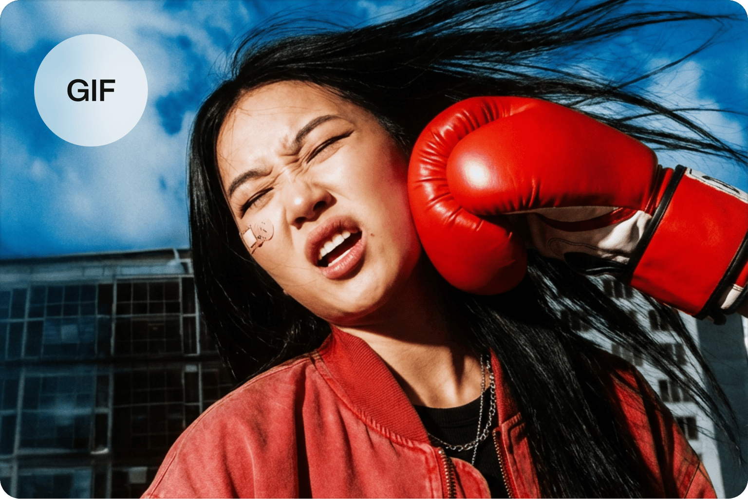 Video frame rate converter showing a GIF icon over a video of a woman getting punched by a red boxing glove