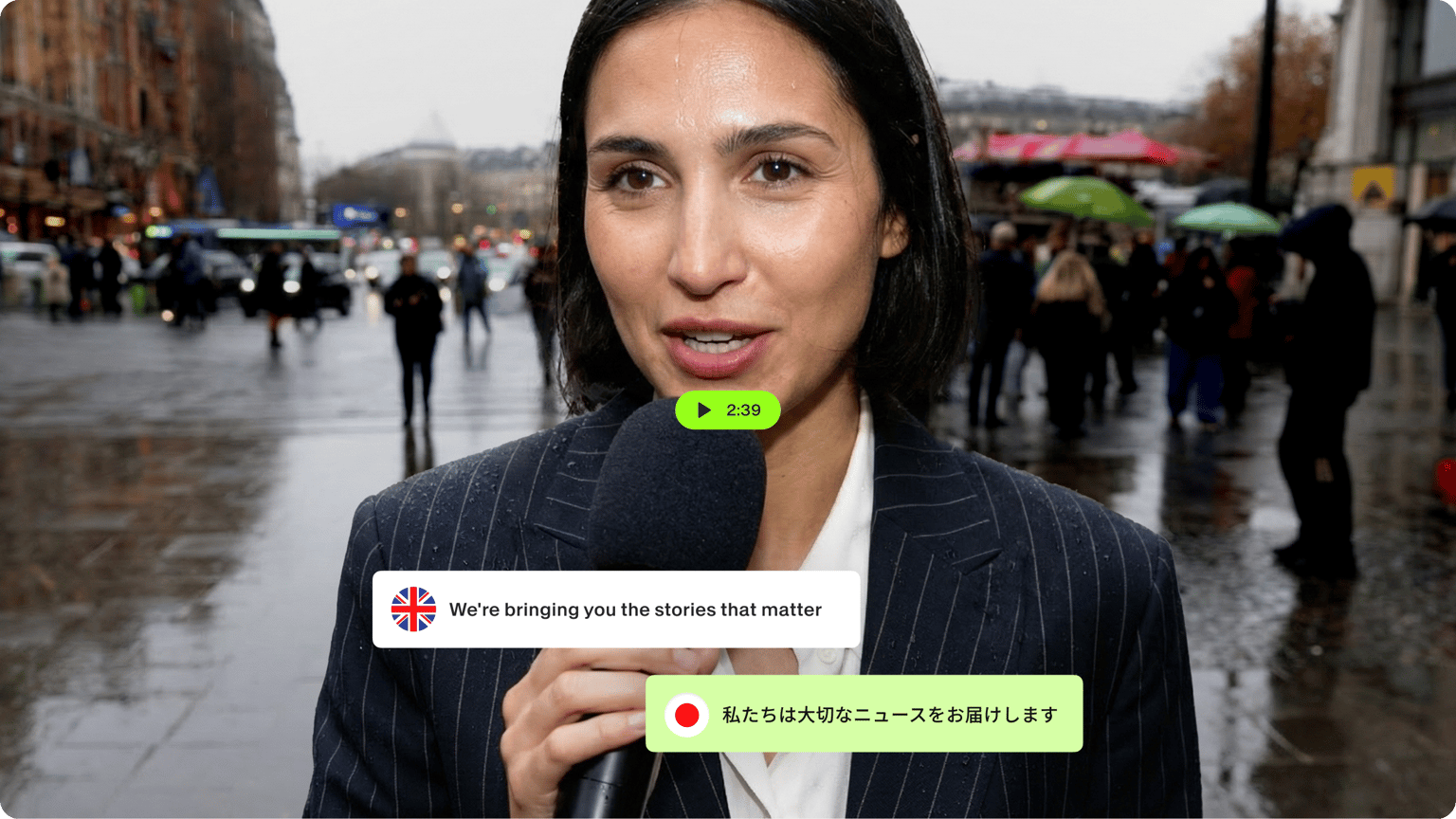 Female reporter with a microphone on a rainy street with a subtitle graphic translating English audio into Japanese.