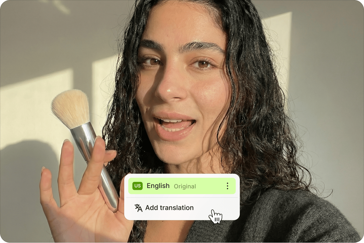 Woman holding a makeup brush with an automatic voice translator menu overlay providing an option to add translation.