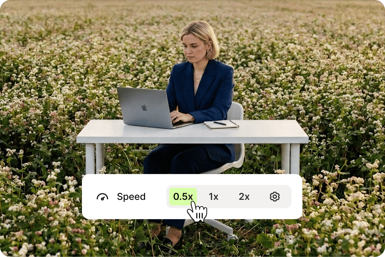 Create a slow motion or timelapse video effect with speed controls set to 0.5x for a woman working on a laptop.