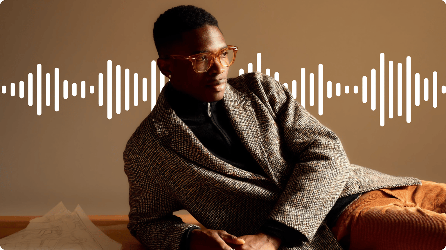 Music visualizer demo showing a white audio waveform over a man wearing glasses and a patterned coat