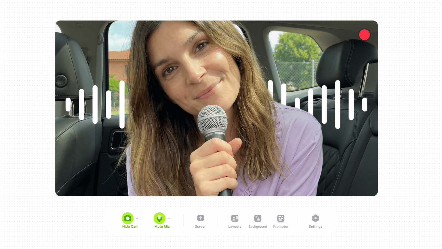 Close up of a smiling woman in a webcam recording frame with recorder settings and menu options below.