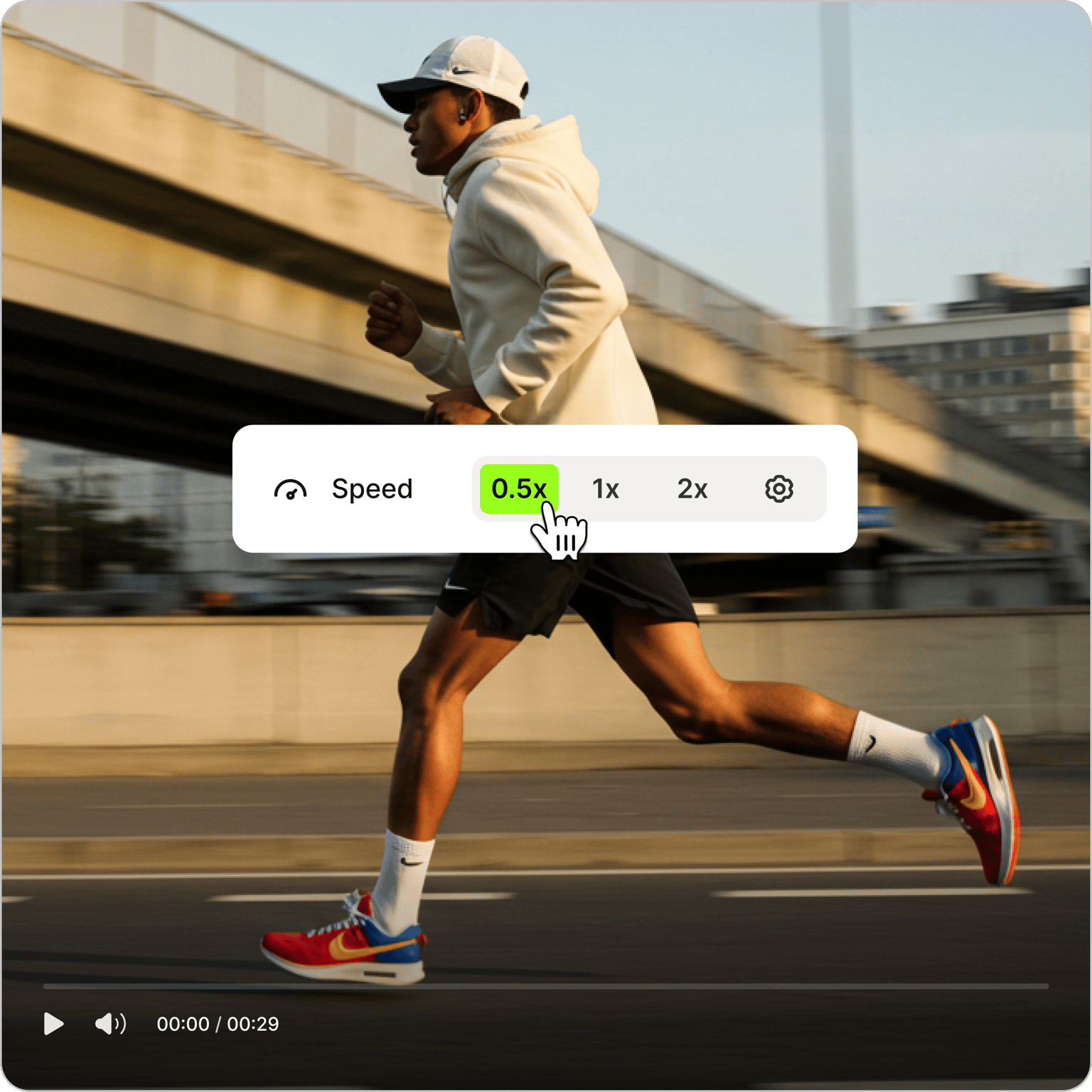 Slow Motion Video tool overlay showing cursor selecting 0.5x speed on video of man running