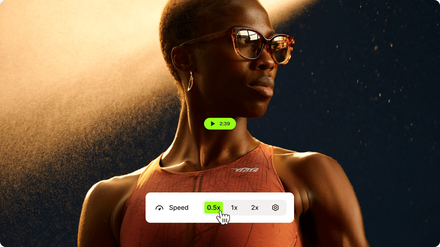 Slow Motion Video demo thumbnail showing cursor clicking 0.5x speed on video of woman in sunglasses with water spray