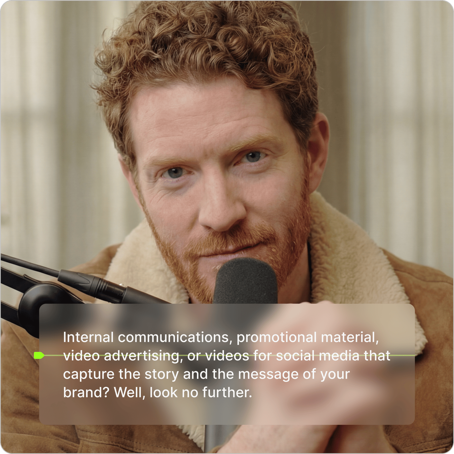 Teleprompter tool showing a script over a video of a bearded man speaking into a studio microphone