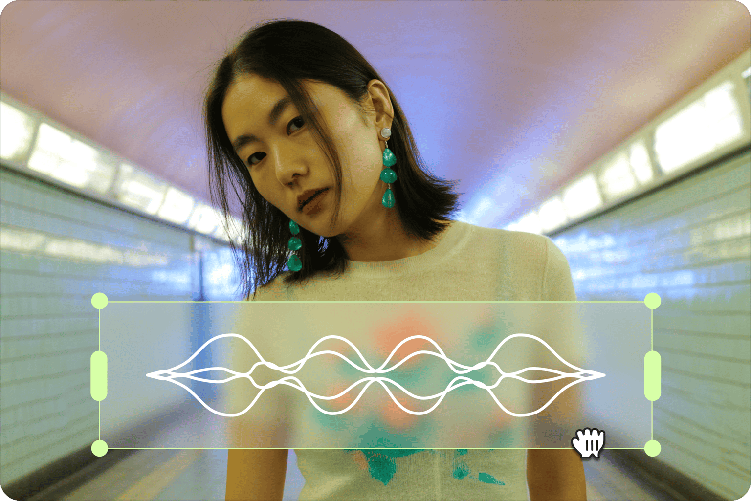 Music visualizer showing a cursor resizing a white audio waveform over a video of a woman in a tunnel