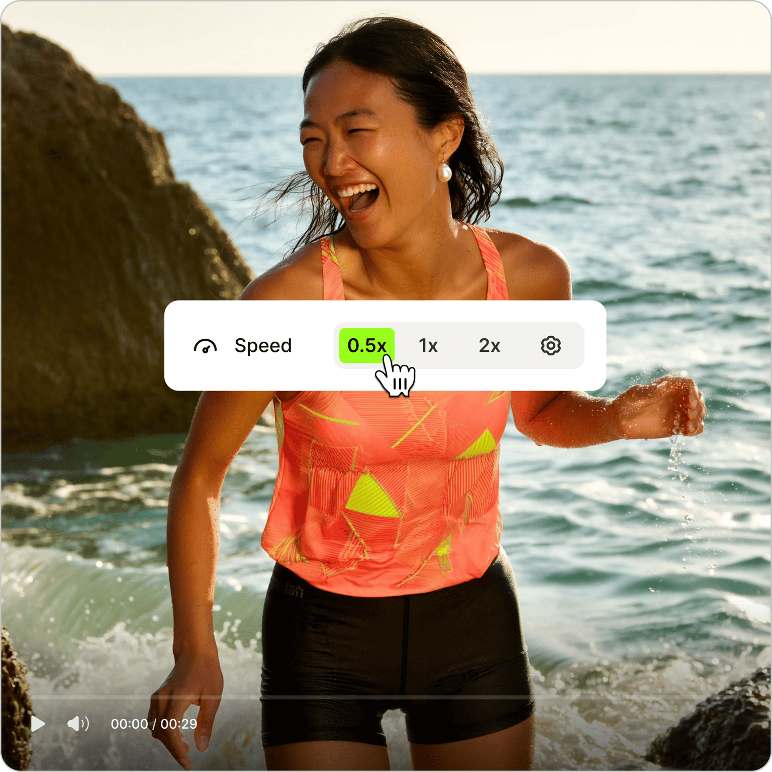 Woman laughing by the ocean with a video speed control overlay in a time lapse video editing interface.