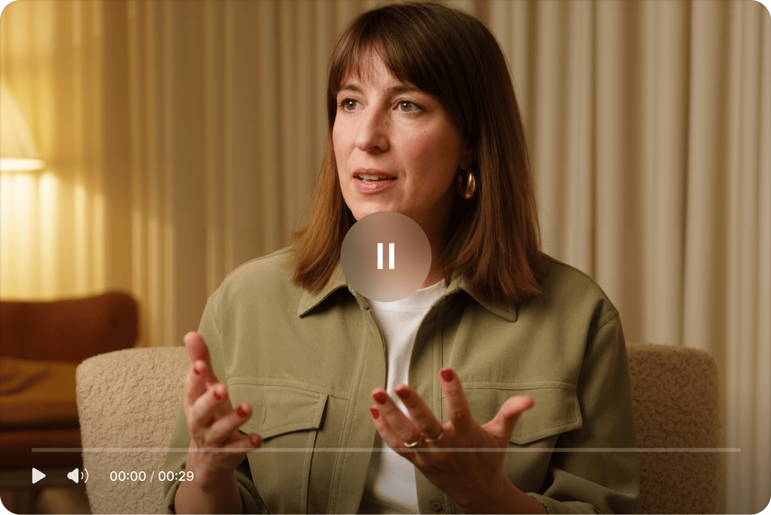 Woman speaking on camera with video playback controls, showing a scene ready for transcription and content editing.