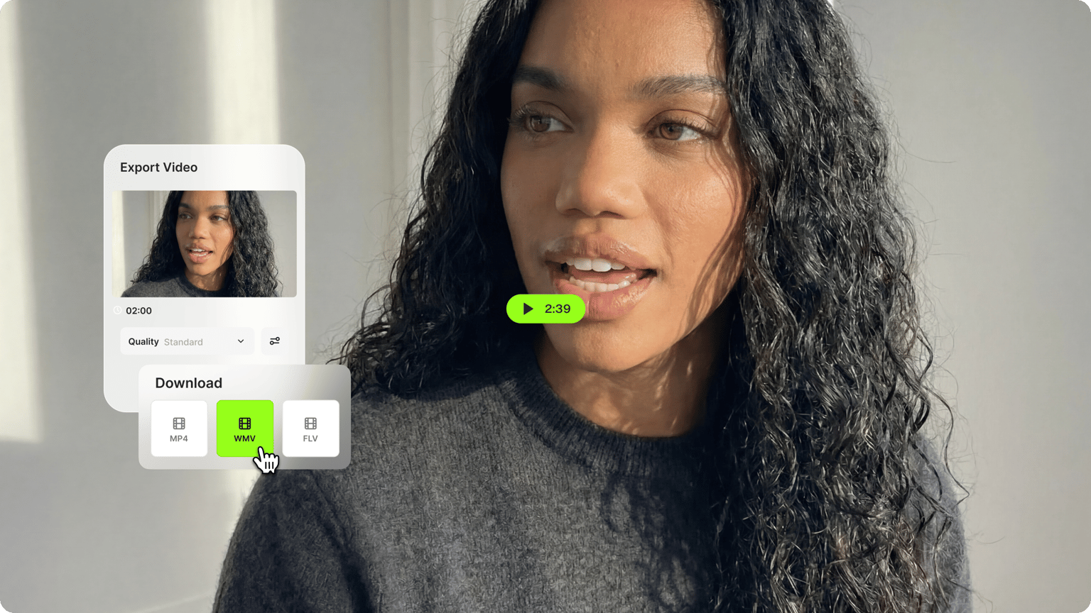 Woman with curly hair exporting a standard quality video choosing the green WMV download button option.